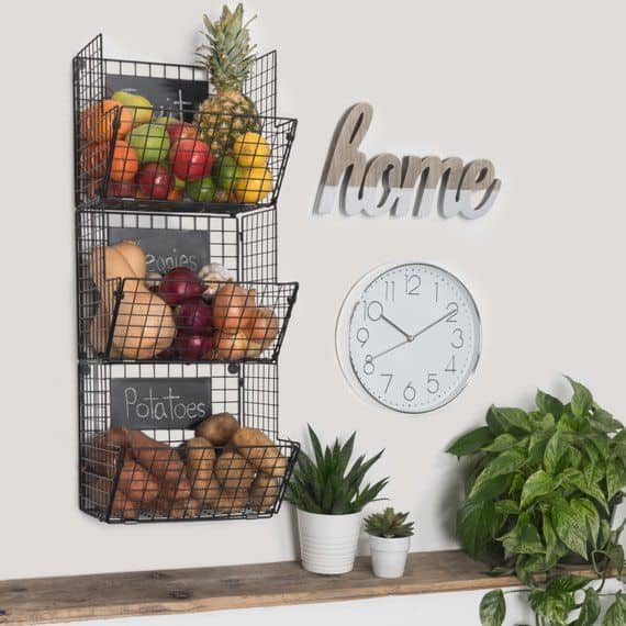 On wall produce baskets with a sign