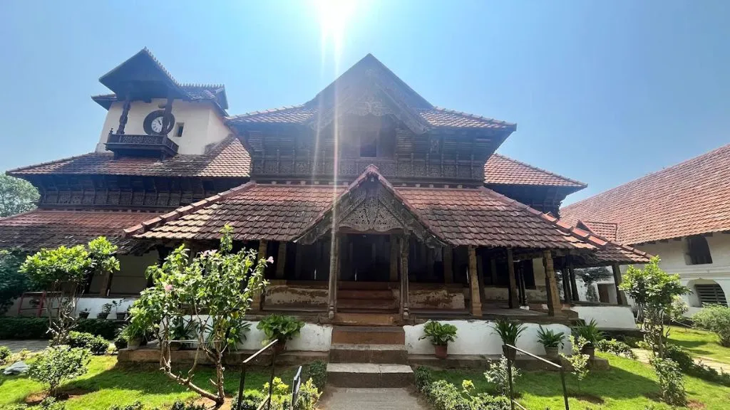 Simple Traditional Kerala House Designs: Types, Features & Low-Budget Building Secrets 8 Raised Foundation & Carved Pillars in old Kerala Palace